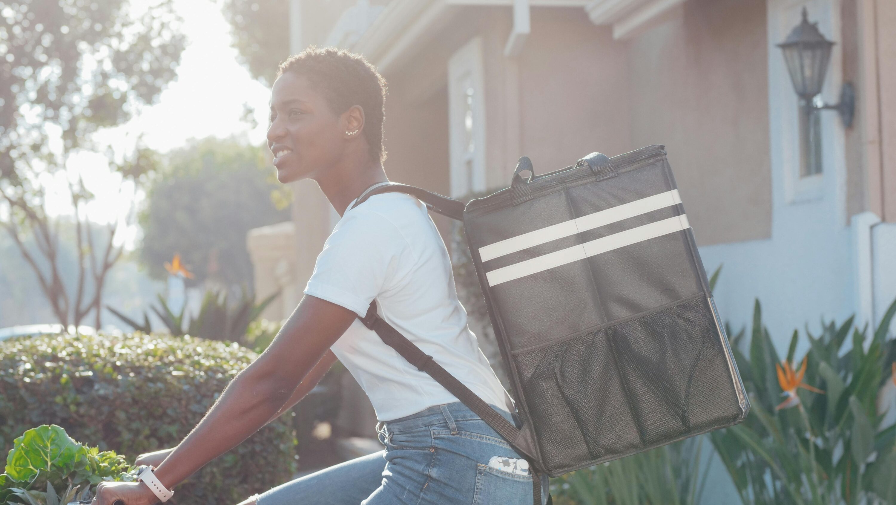 Woman on delivery bike, delivering for ecommerce website